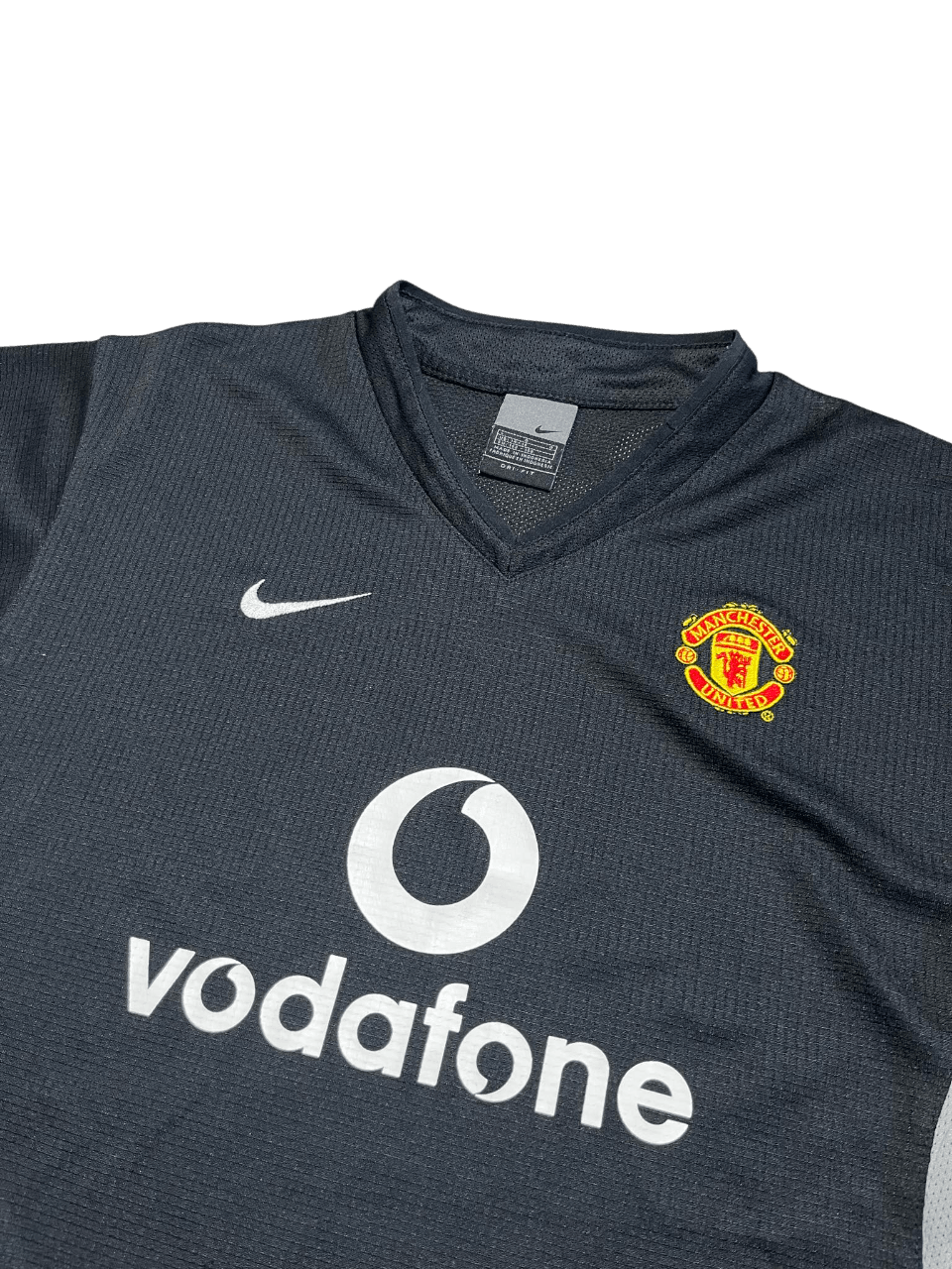 Fekete Nike Manchester United focimez Vodafone logóval, vintage streetwear stílus