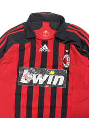 Vintage piros-fekete csíkos Adidas AC Milan futballmez, kopott Bwin logóval.