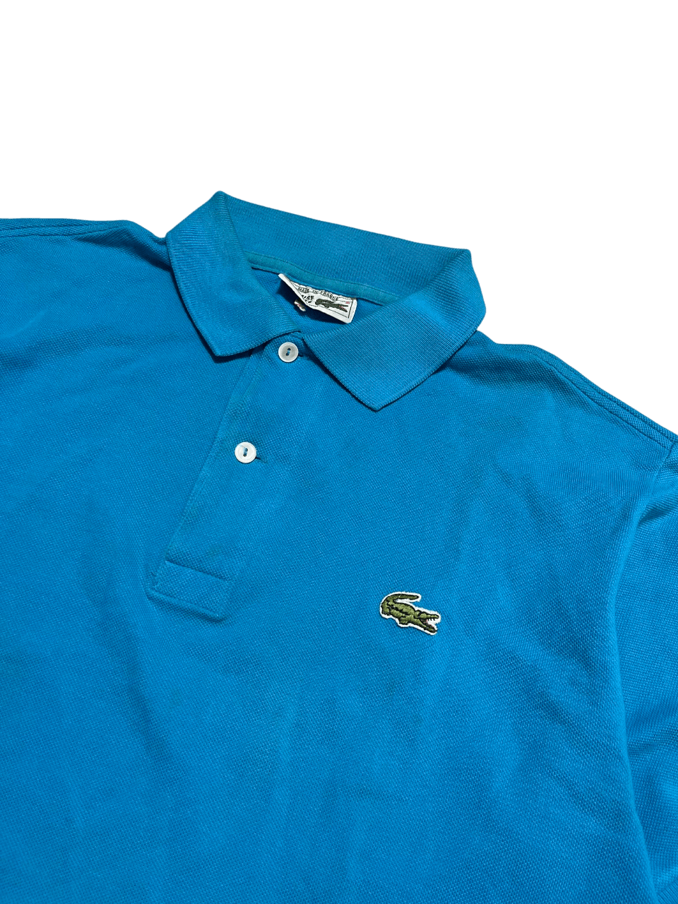 Kék vintage Lacoste galléros póló, hímzett krokodil logóval, streetwear stílus